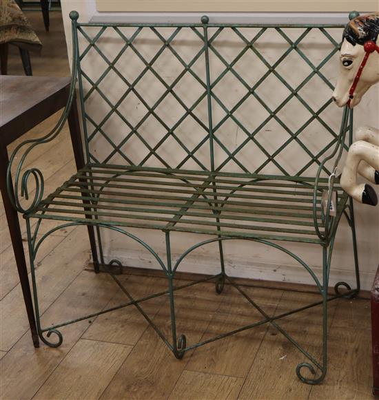 A green painted slatted wrought iron bench L.91cm